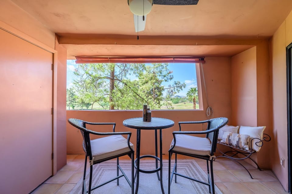 Over sized covered patio with sun shade.