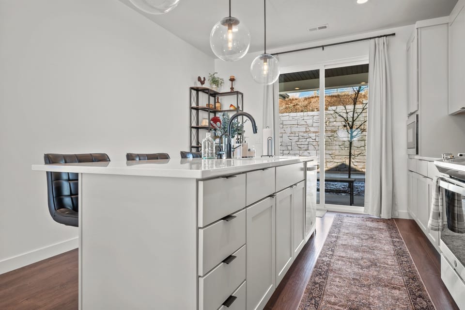 Access to the patio is through the sliding glass doors in the kitchen.