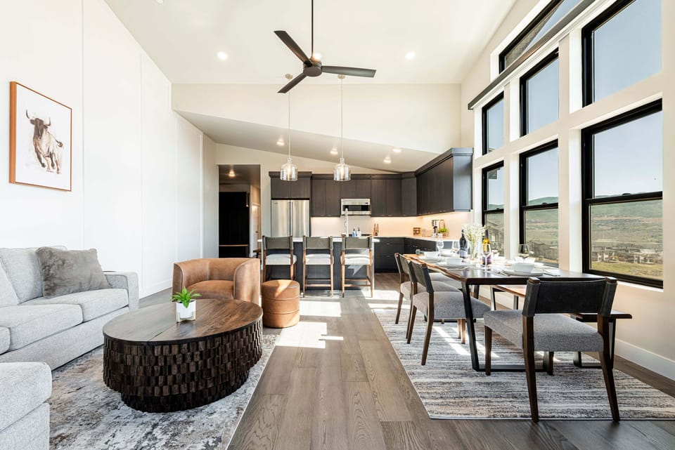 Great room with a vaulted ceiling and plenty of natural light and views