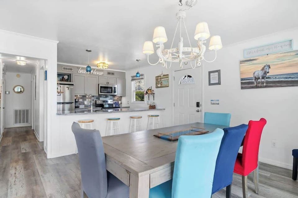 Dining Area: Bright colors and beachy decor create an inviting space for meals and memories!