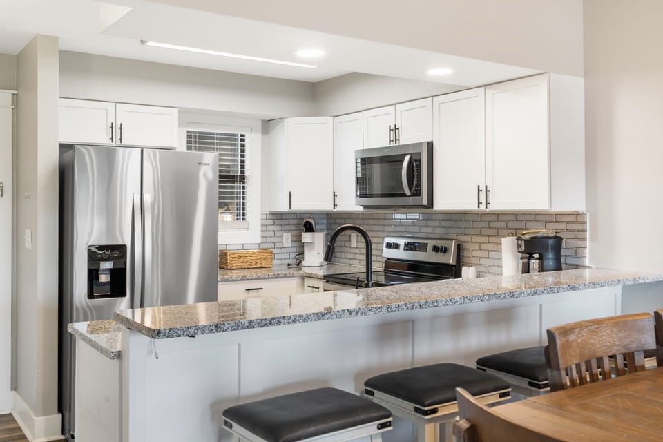 Fully Equipped Kitchen with Upgraded Appliances and Extra Bar Seating