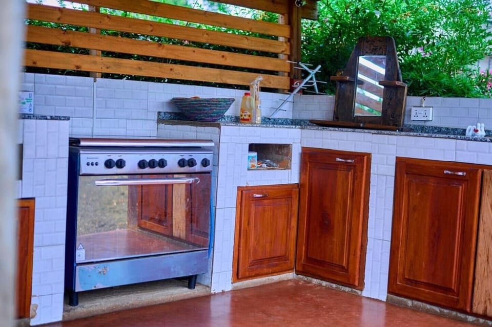 Mini-fridge, stovetop, dishwasher, cookware/dishes/utensils