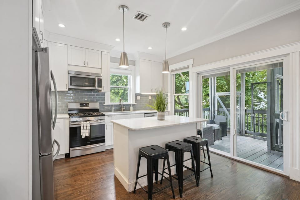 Kitchen Unit 2 | Open Concept Kitchen with Island and Bar Seating | Unit 2 — Second Floor of Building — Unit on One Level