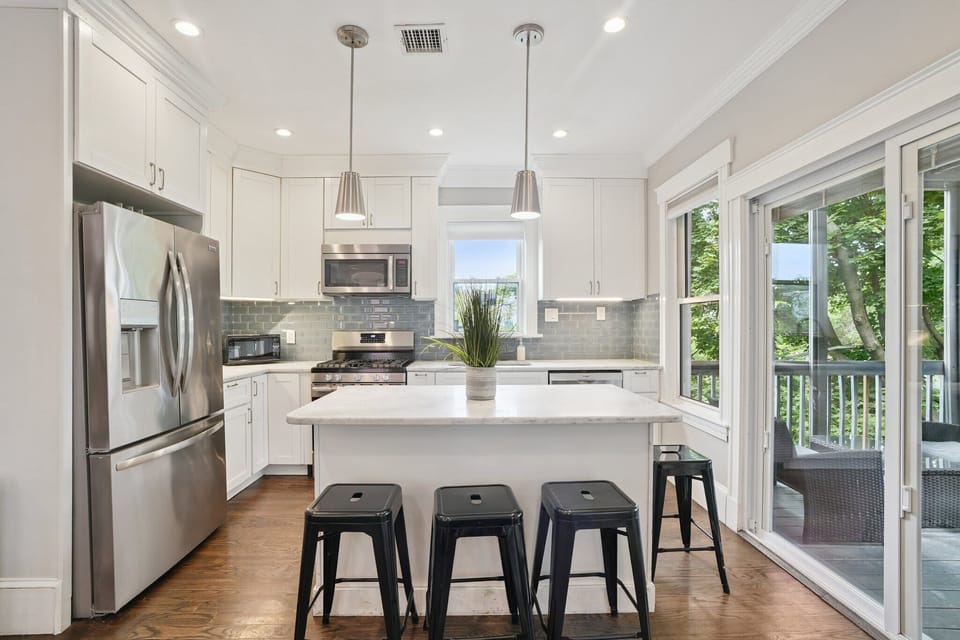 Kitchen Unit 2 | Open Concept Kitchen with Island and Bar Seating | Unit 2 — Second Floor of Building — Unit on One Level