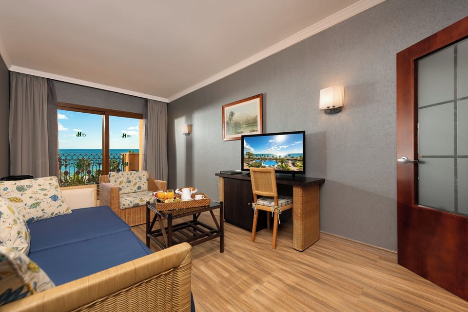 Junior Suite, Terrace, Sea View | Living area | 32-inch LED TV with digital channels, TV