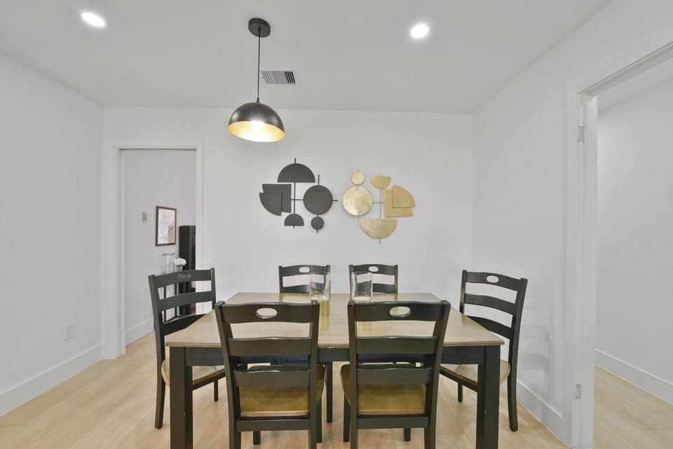 The spacious dining area seats up to eight comfortably, making it perfect for group meals, celebrations, and shared experiences around the table.