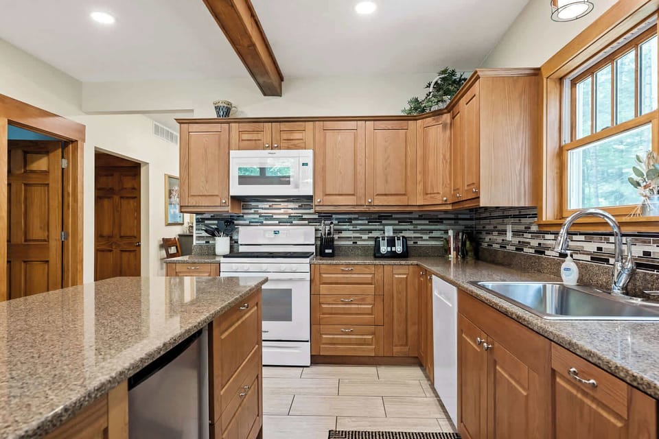 Scott Creek Lodge kitchen & half bathroom (left). Behind you - living room;  past the stove - dining room