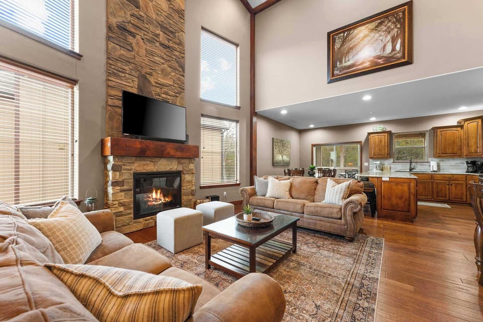 Vaulted ceilings and a stone fireplace create a grand living space!