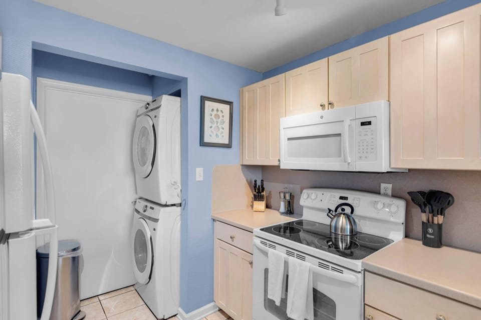 Full Kitchen with Water View; Dishwasher, Stove/Oven, Microwave; Full Size Washer & Dryer In-Unit