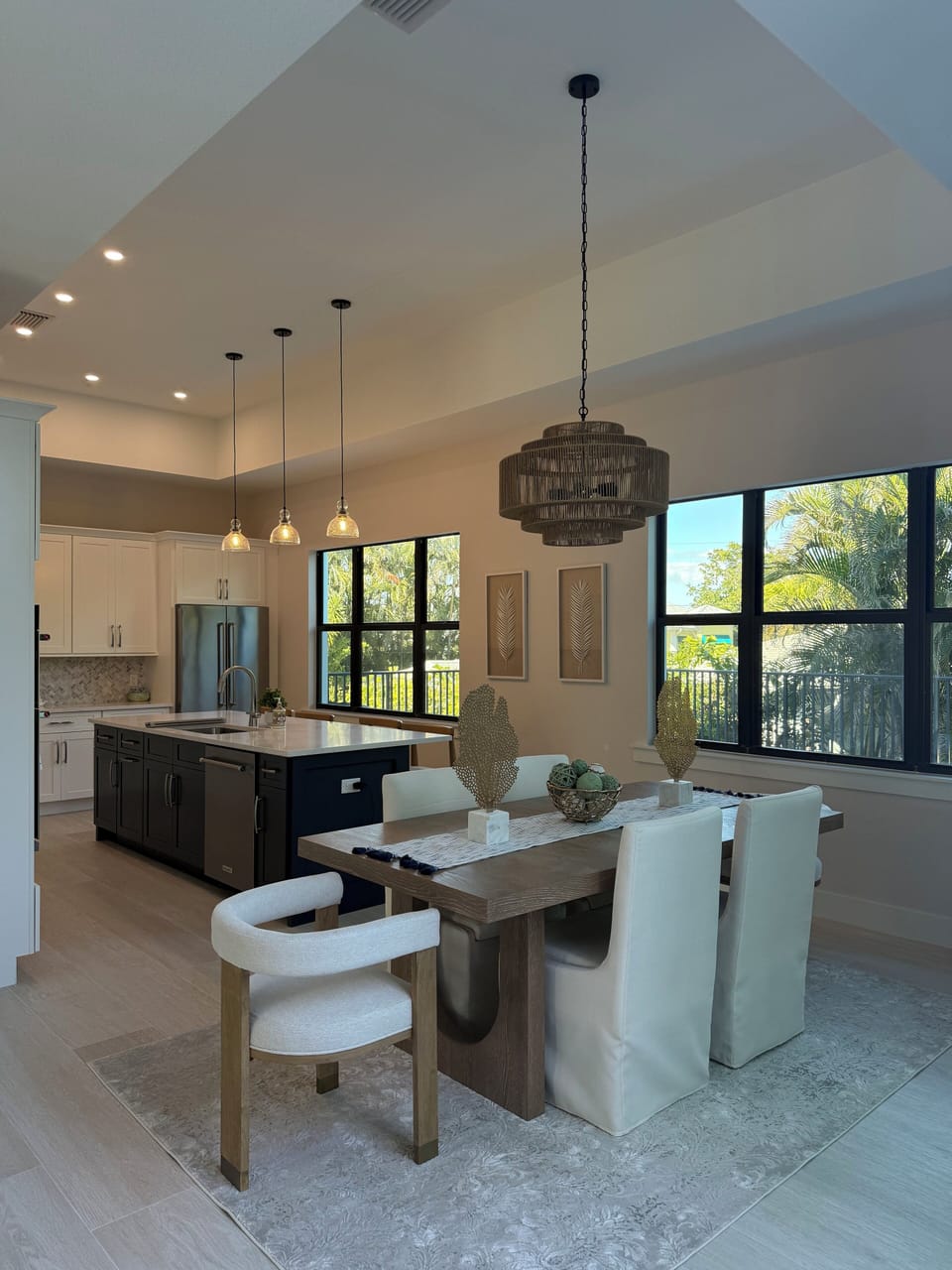 Dining table area with kitchen in background.