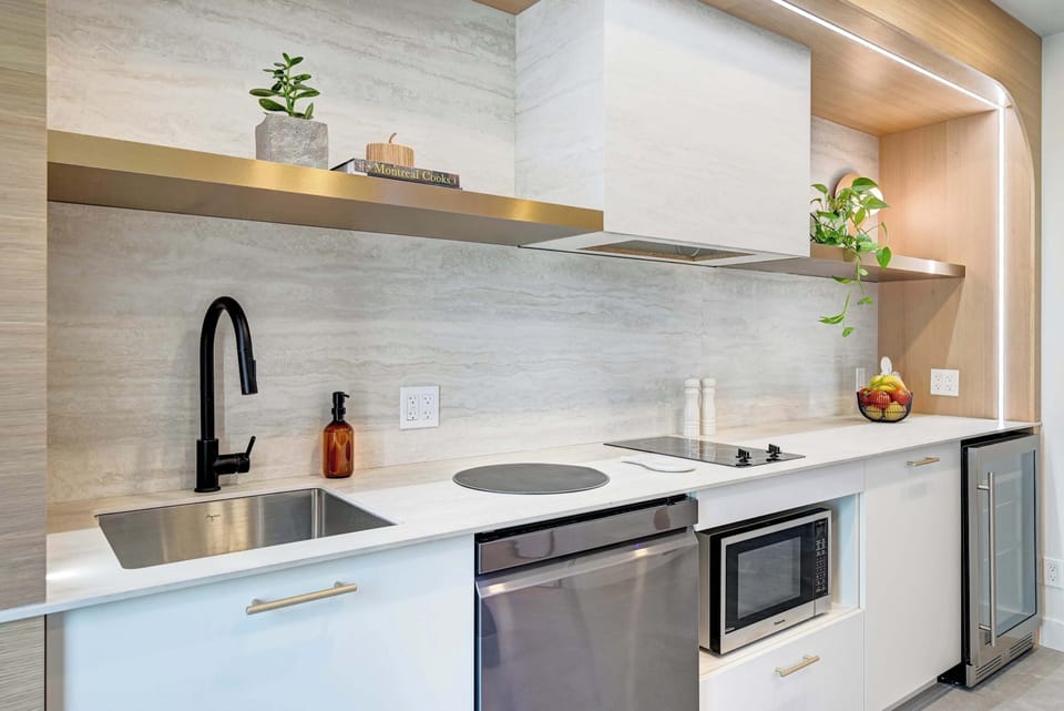 Kitchen #1, RA side. Equipped with small appliances, plates and cutlery to dine in. 