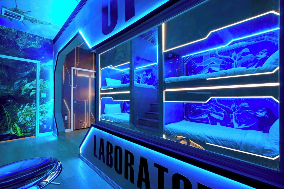 Futuristic bunk room with glowing neon lights and immersive sci-fi lab theme
