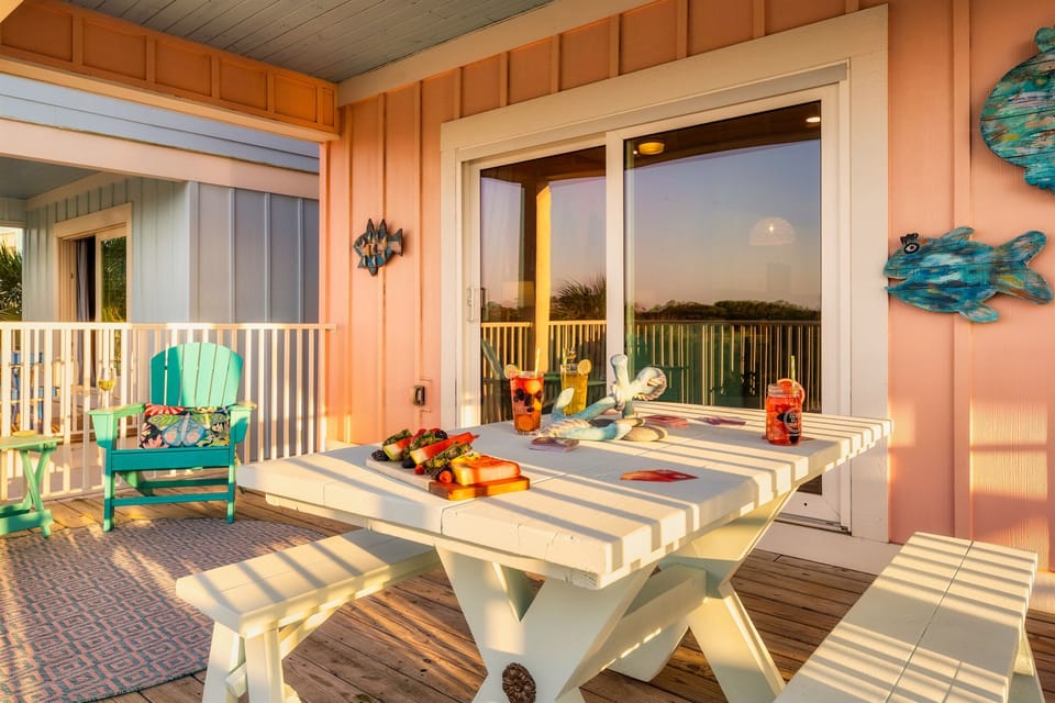 Coastal charm meets comfort on this colorful deck designed for relaxing get-togethers.