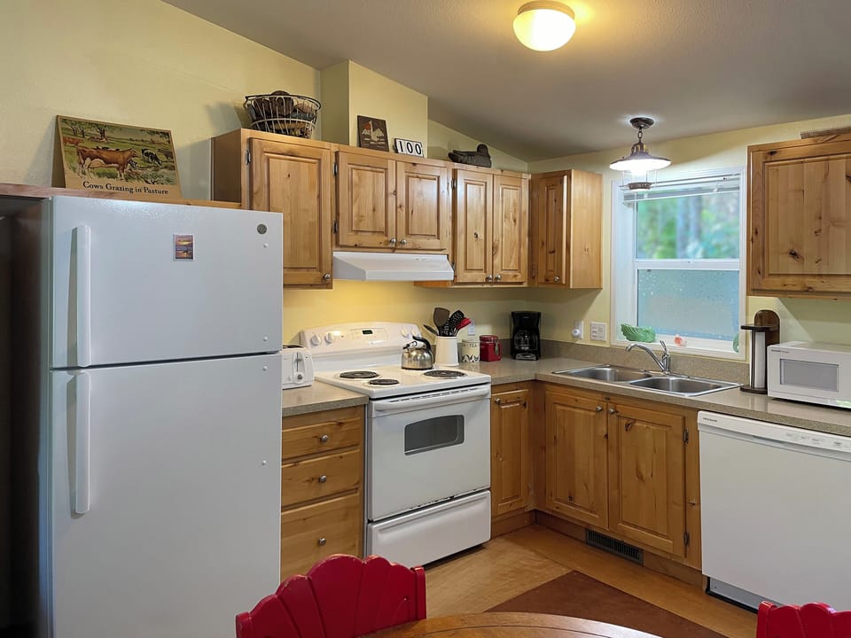 Fully equipped kitchen with seating.