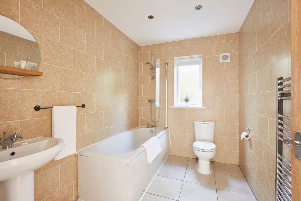 Main bathroom with a shower. A quick wash, or a relaxing soak. The choice is yours. There`s another shower room and 2 WC`s, so you won`t have to worry about waiting to get ready.