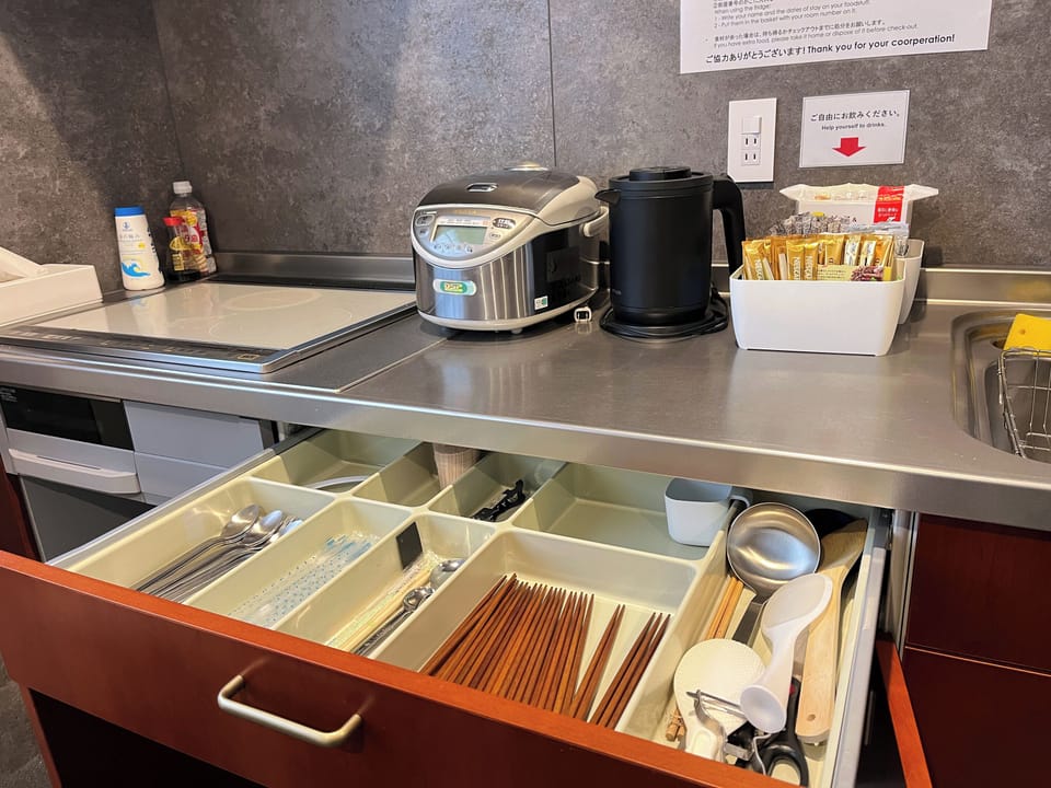 Full-size fridge, microwave, stovetop, rice cooker