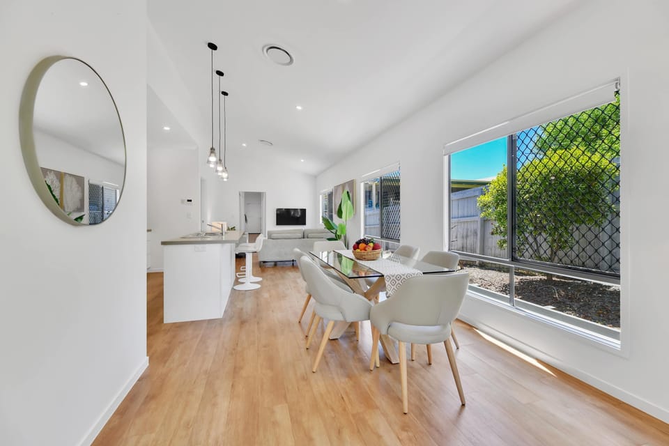 Glass dining table In open plan dining/ living/ kitchen