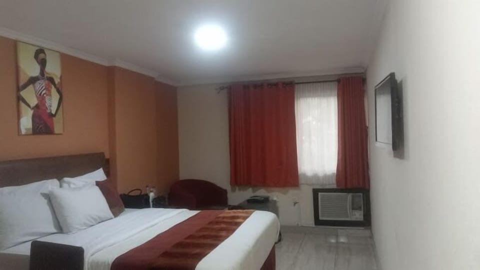 Deluxe Room, Balcony, City View | Desk, laptop workspace, blackout drapes, soundproofing