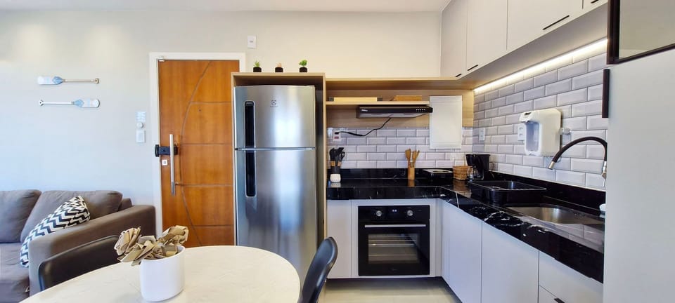 Panoramic Apartment | Private kitchen | Fridge, coffee/tea maker, cookware/dishes/utensils, dining tables