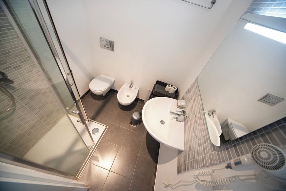 Double Room, Balcony, City View | Bathroom | Shower, free toiletries, hair dryer, bidet
