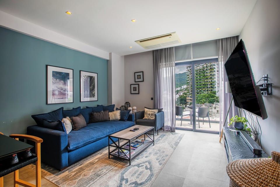 Comfortable living room with smart TV and access to the balcony