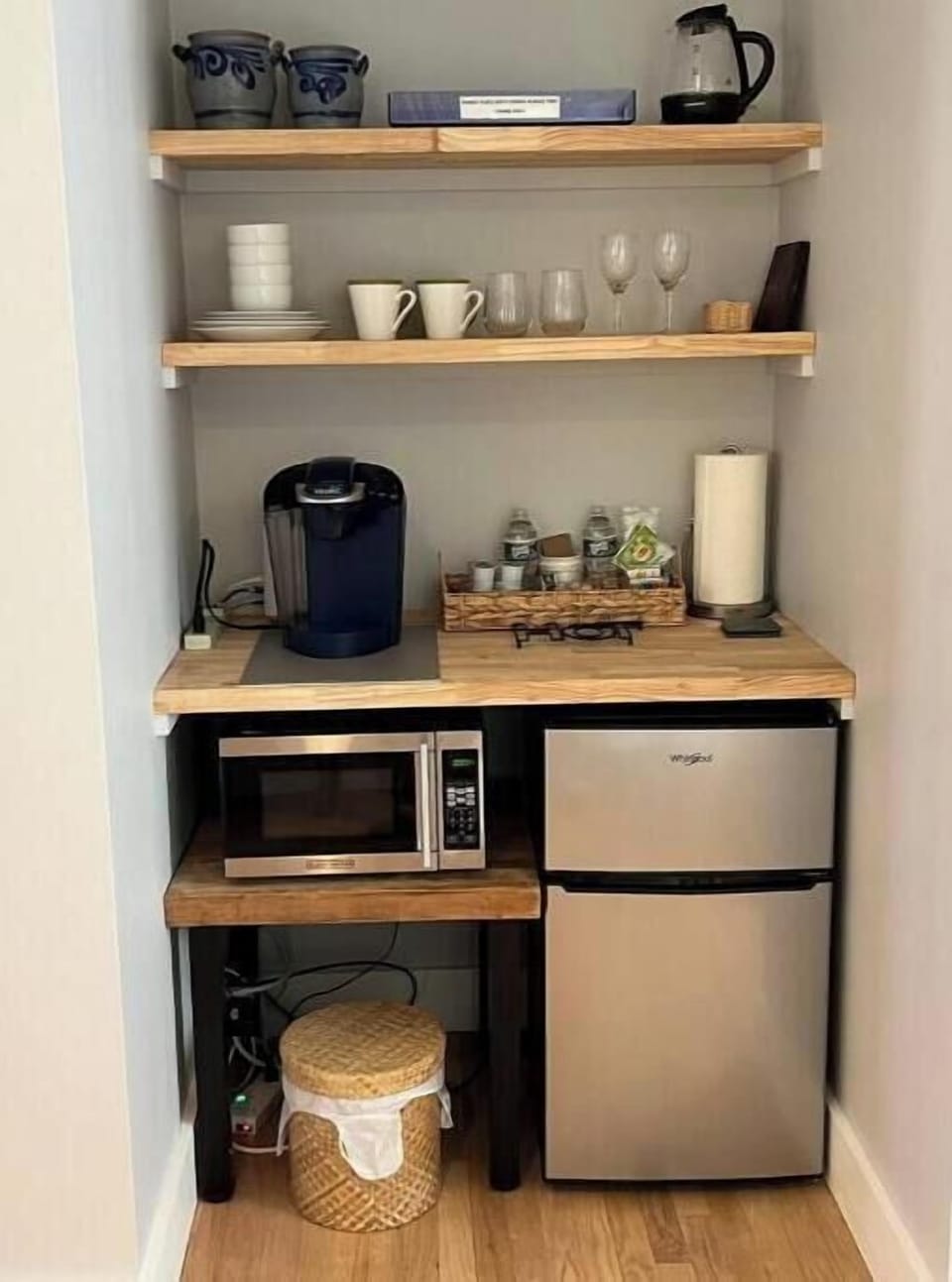 Kitchenette with coffee maker, kettle, microwave, fridge/freezer, dishes etc.