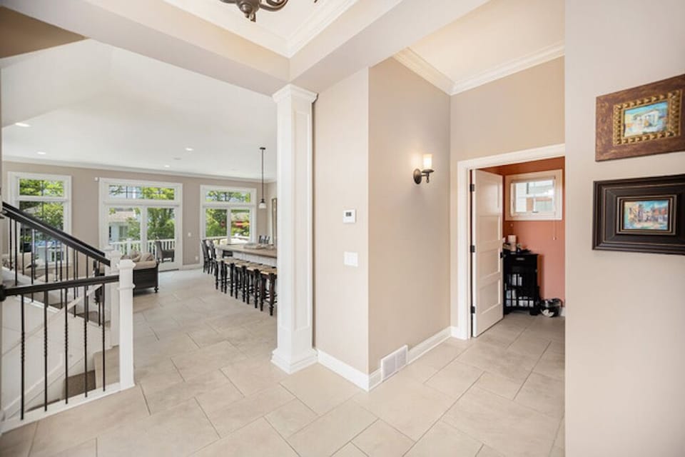 View of the kitchen and family room from the entry foyer on the main level.