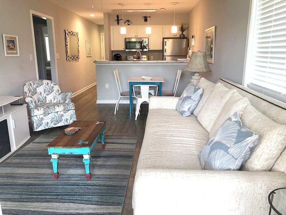 Looking from porch into living room and kitchen.