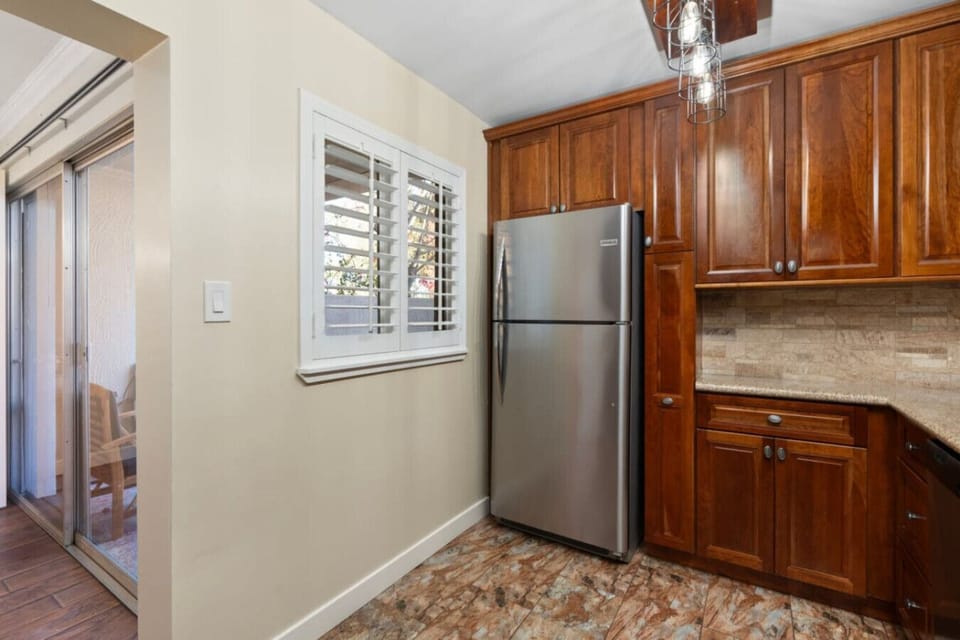 Warm wood tones and modern touches—your perfect kitchen space!