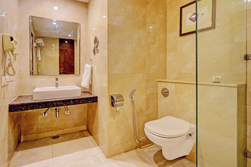Family Suite, City View | Bathroom | Shower, designer toiletries, hair dryer, slippers
