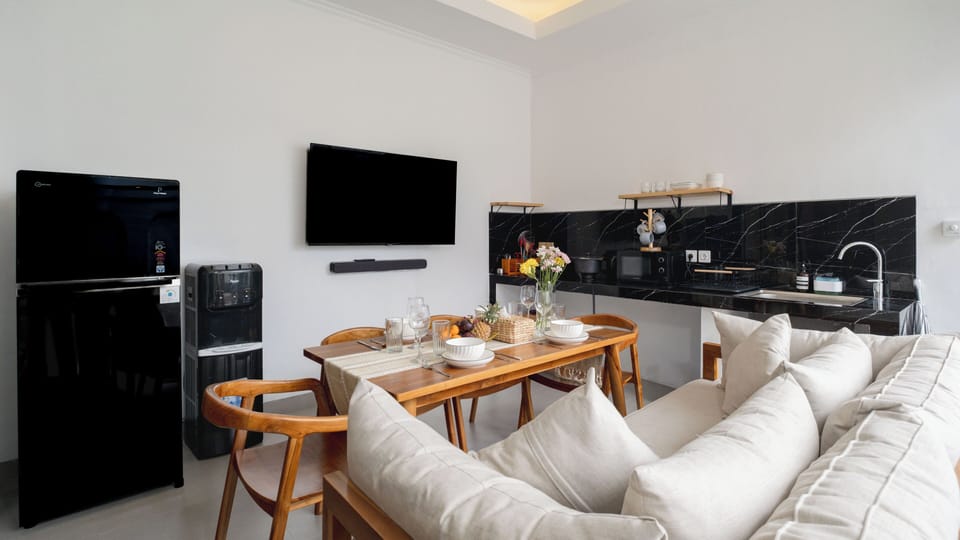 Family Villa | Living area | 32-inch LCD TV with cable channels