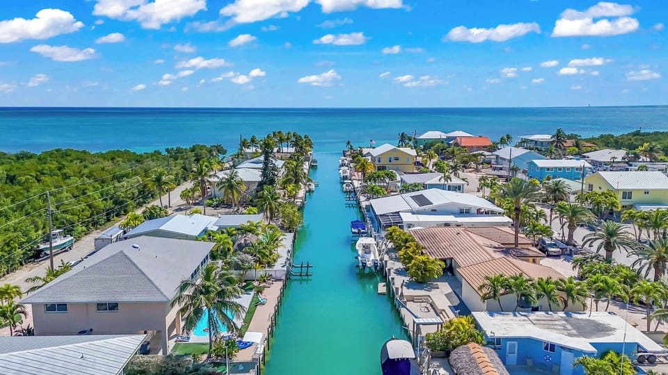 Paradise Palms - A peaceful waterfront retreat with private dock, heated pool, and breathtaking sunset views — the perfect blend of luxury and coastal charm.