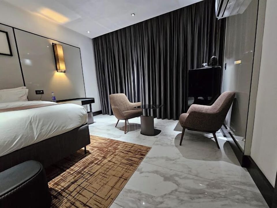 Family Room, Balcony, City View | Desk, laptop workspace, blackout drapes, soundproofing