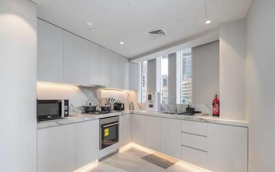Luxury Apartment, City View | Private kitchen | Full-size fridge, microwave, oven, electric kettle