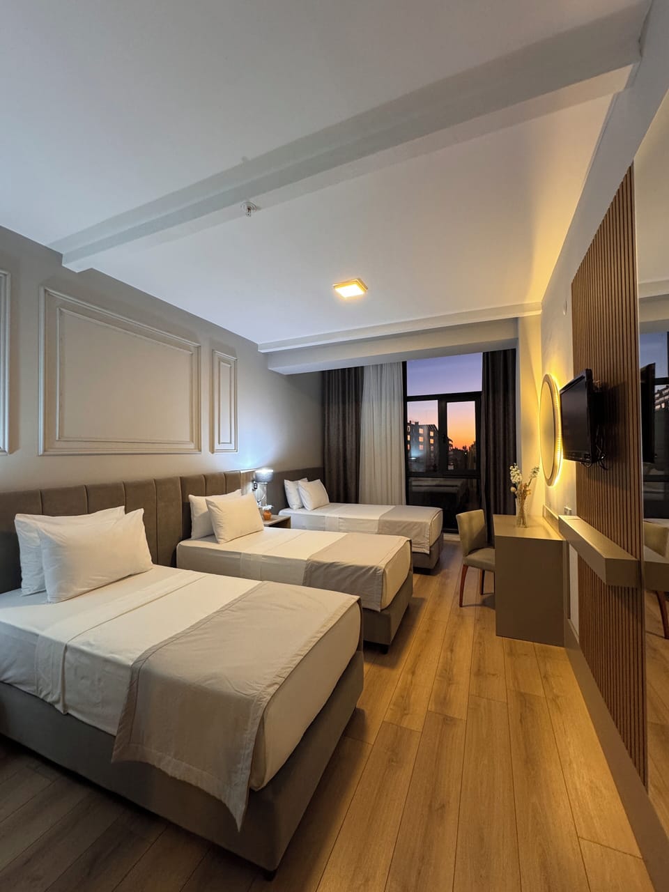Deluxe Triple Room, 3 Twin Beds, Partial Sea View | Minibar, in-room safe, desk, laptop workspace