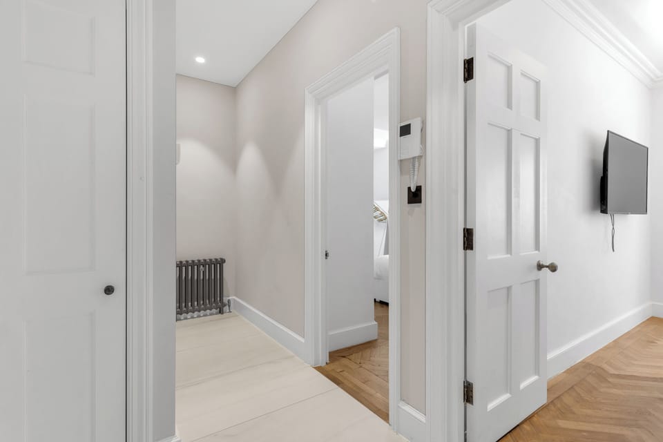 🚪 Clean, modern hallway with tile floors