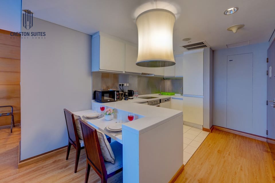 The kitchen and dining area layout and furnishings may vary slightly between rooms, yet each offers a stylish, comfortable, and well-appointed setting for your stay