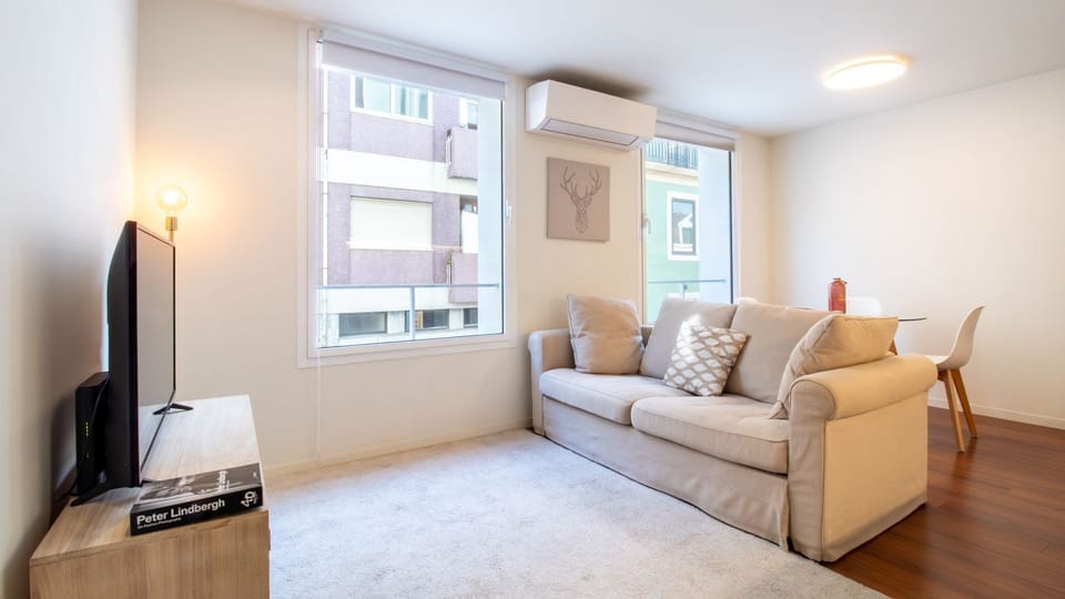 A calm and inviting lounge featuring soft neutral tones, comfortable seating, and abundant natural light. The ideal spot to recharge after a day exploring the city.
#LovelyStay #UrbanRetreat #ModernApartment#TravelPortugal #VacationRental
