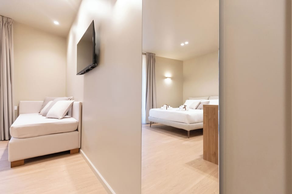 Deluxe Double Room, City View | Desk, laptop workspace, soundproofing, iron/ironing board