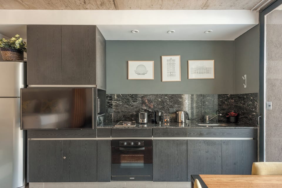 Deluxe Apartment, Balcony, Pool View | Private kitchen | Full-size fridge, microwave, oven, stovetop