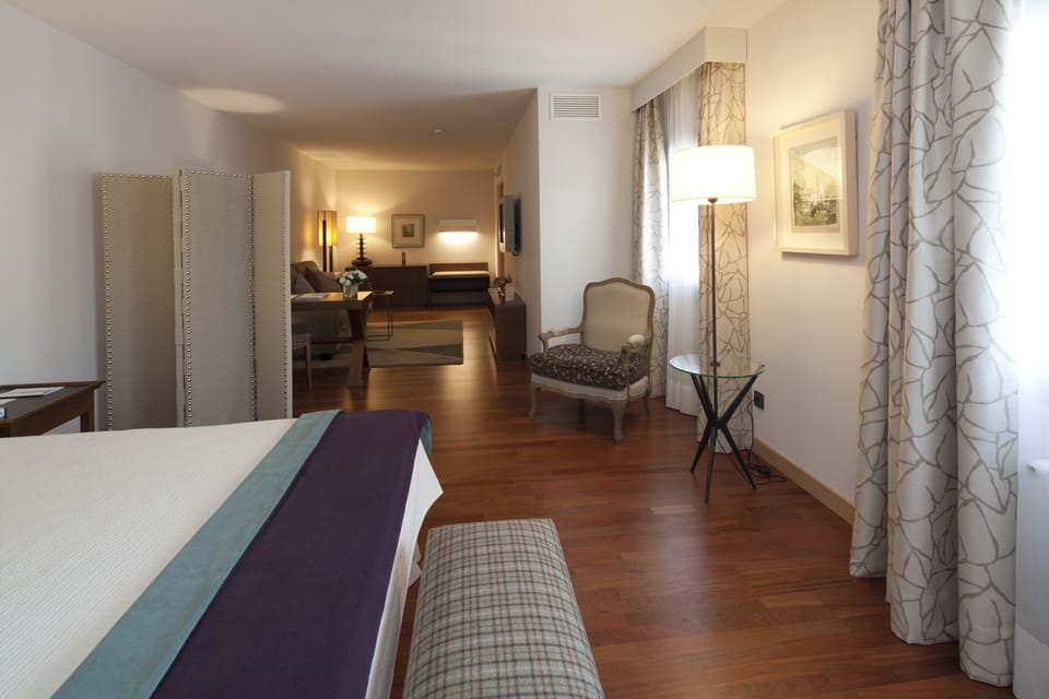 Junior Suite | 2 bedrooms, premium bedding, down comforters, minibar