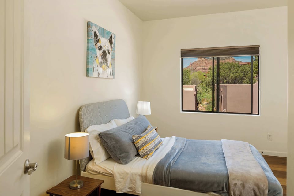 Upstairs Full bed with epic red rock views and entry way with door to full bathroom