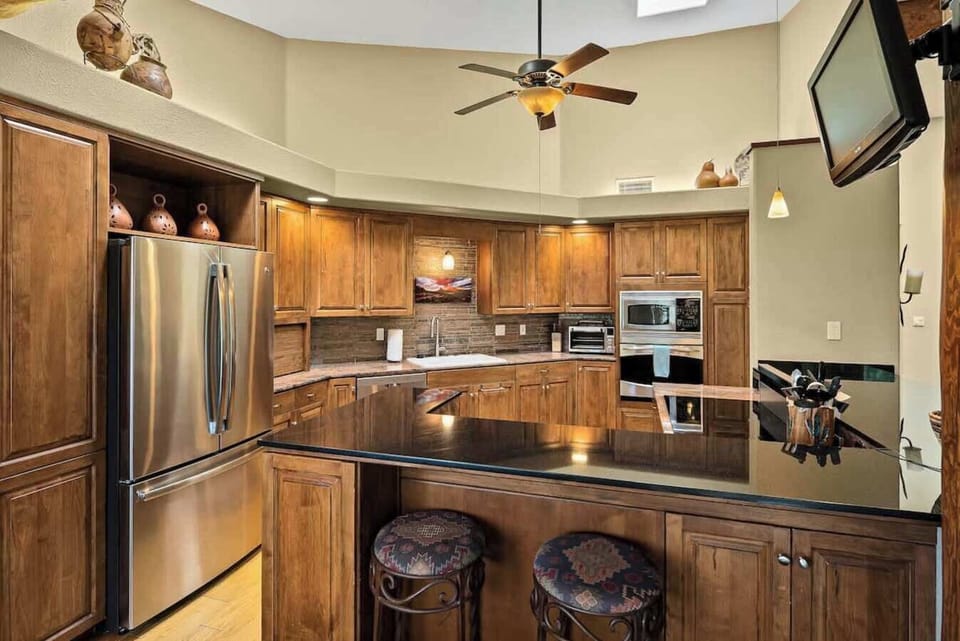 Modern kitchen with a breakfast bar—fully equipped for your culinary adventures.