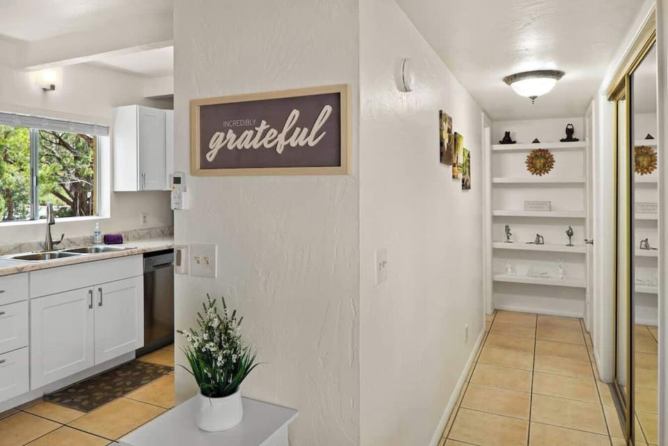 Cozy and inviting hallway leading to closet.