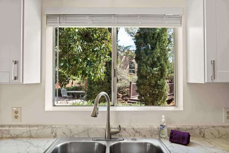 Prepare meals with ease in this kitchen with a view!