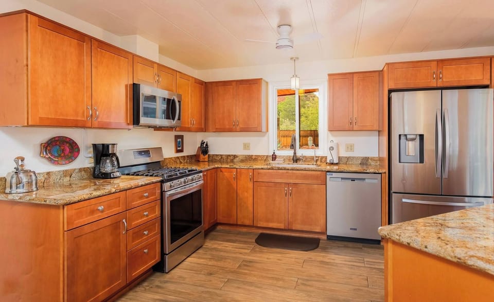 Spacious kitchen stocked with everything needed for home-cooked meals.
