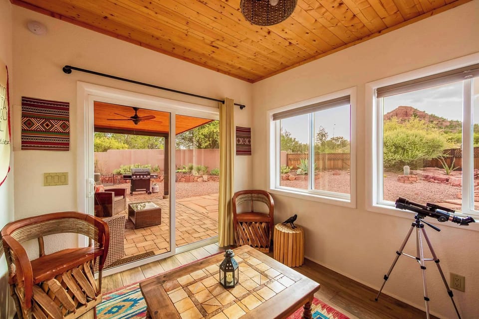 Sunroom with comfortable seating and stunning views of Thunder Mountain.
