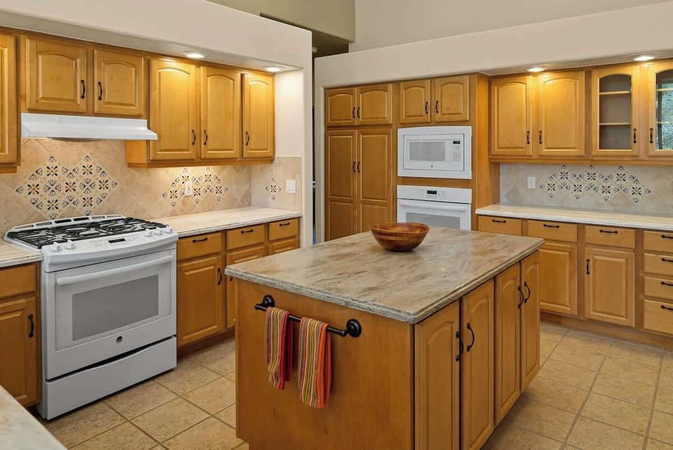 Cook with ease in the spacious, fully equipped kitchen featuring a central island.