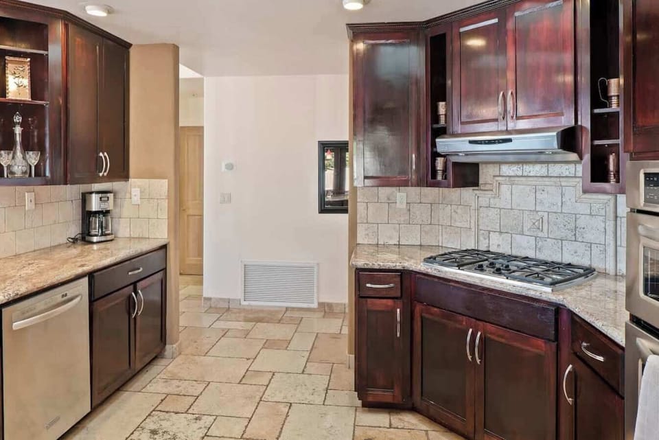 Sleek kitchen with stainless steel appliances. Your culinary adventures await!