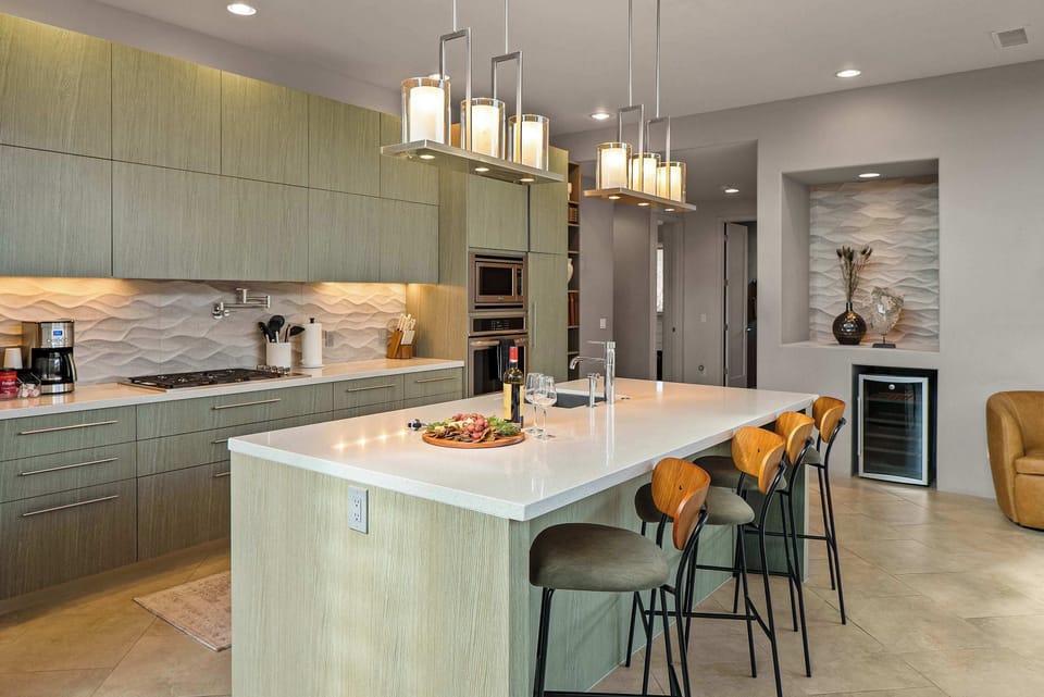Fully equipped kitchen with a spacious island, perfect for entertaining.